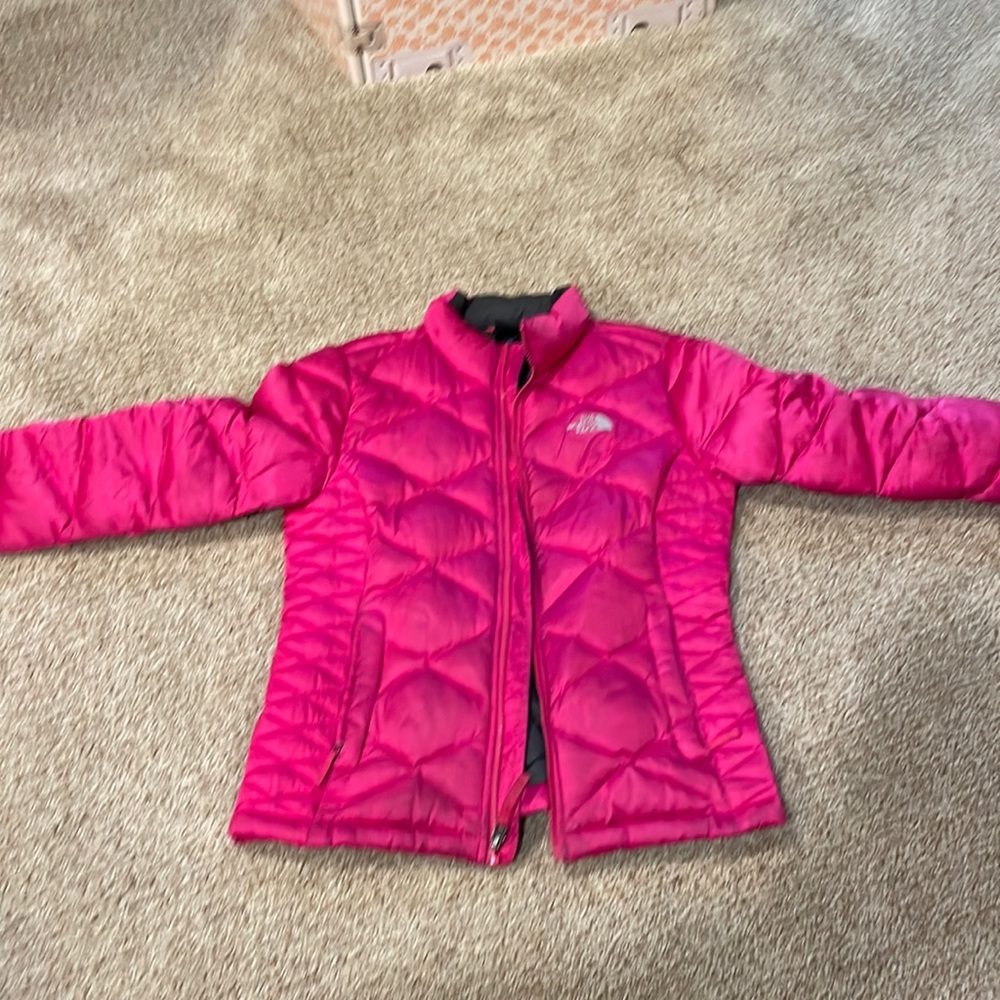 reversible pink and gray North Face jacket